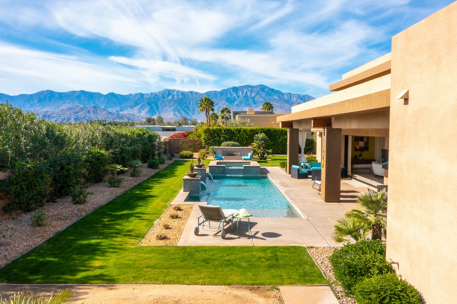 Backyard pool and patio with mountain views