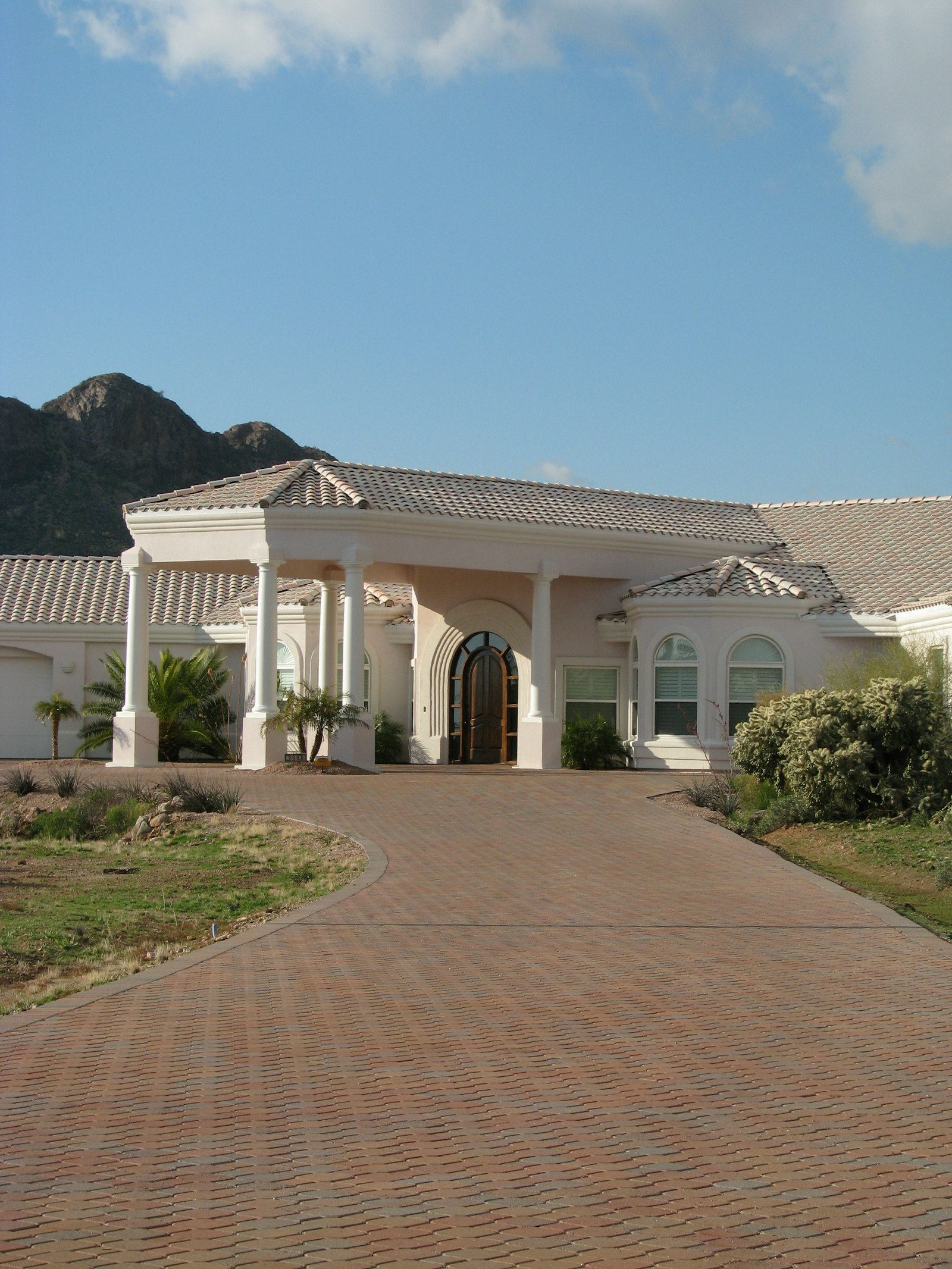 White estate home with mountain views