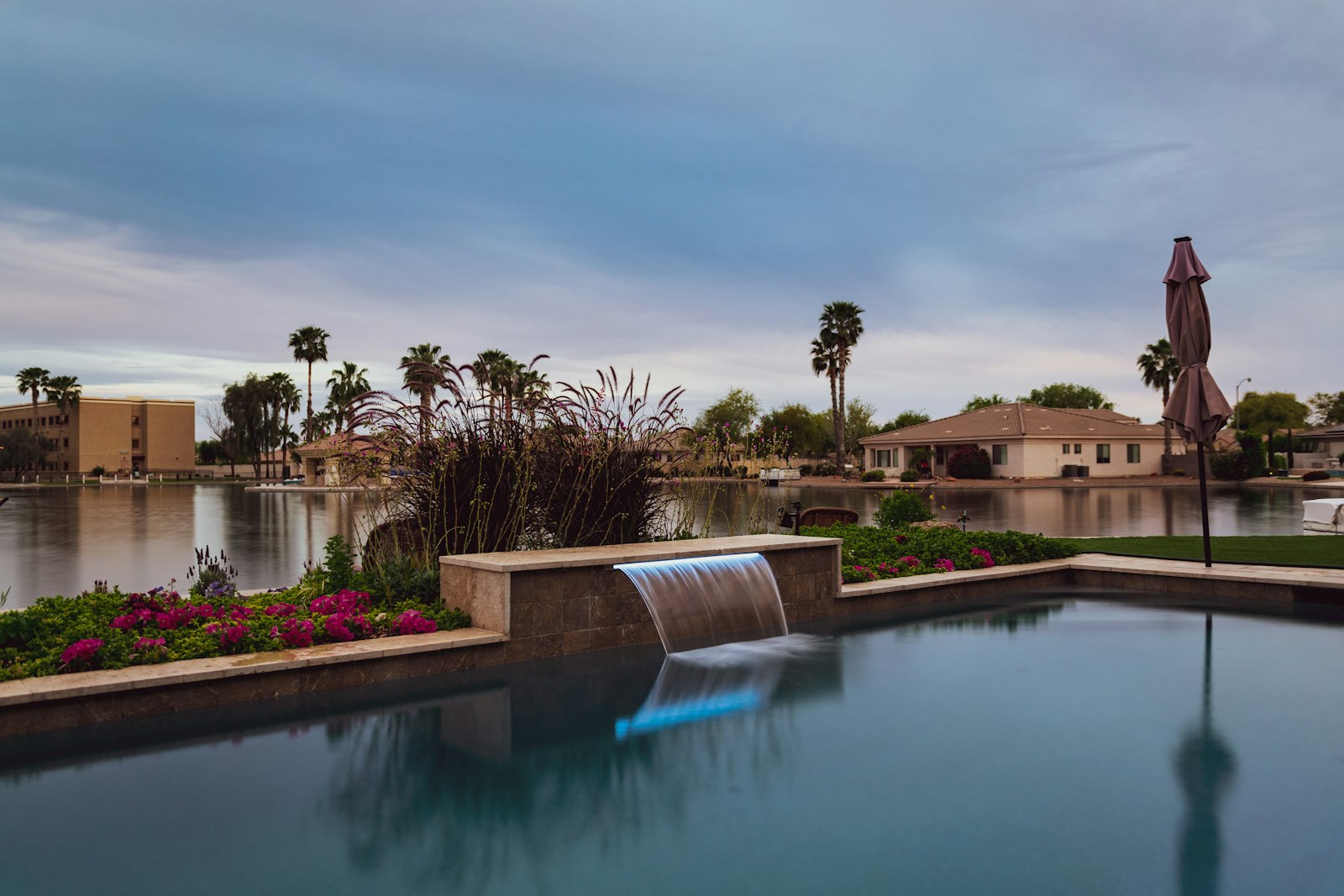 Resort-style backyard pool with waterfall